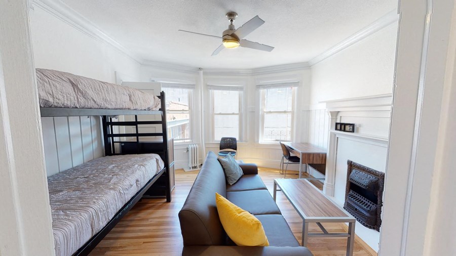 a living room with a bunk bed and a couch